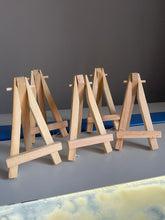 Load image into Gallery viewer, Mini easels for artworks and paintings in Hot Pink, Rustic Brown, Natural Pine and Glittery Gold